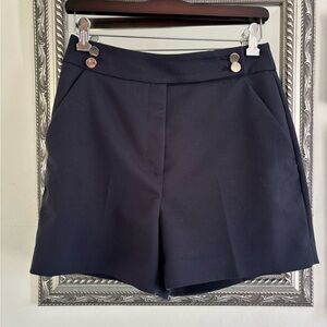 H&M shorts in high waisted navy. EUC with pockets and silver tone button detail.